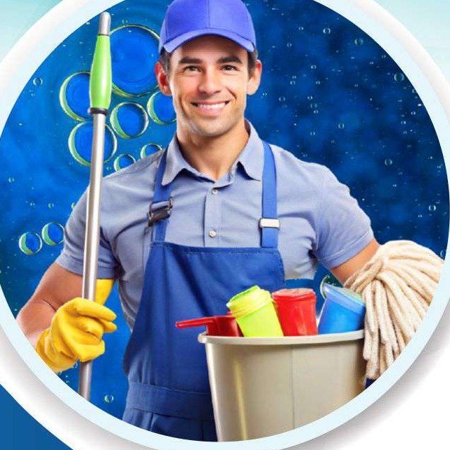 Professional cleaning staff member in uniform with mop and bucket